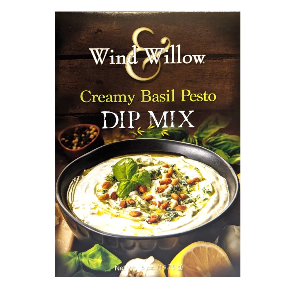 Wind & Willow Creamy Basil Pesto Dip Mix packaging with dip and basil leaves on a wooden background