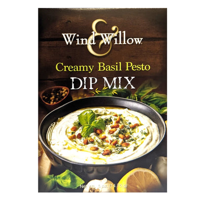 Wind & Willow Creamy Basil Pesto Dip Mix packaging with dip and basil leaves on a wooden background