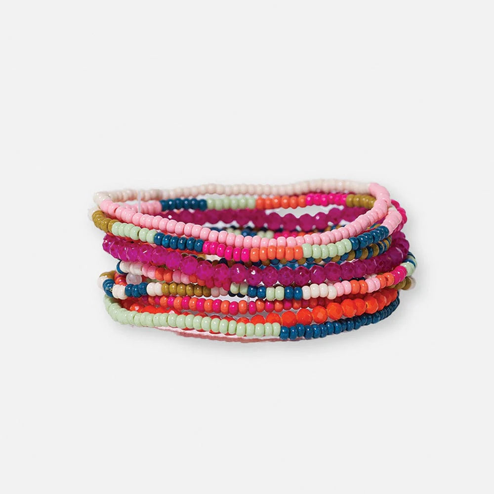 Stack of colorful beaded bracelets on a white background