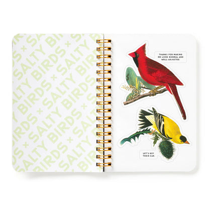 Notebook with bird illustrations and text on a white background