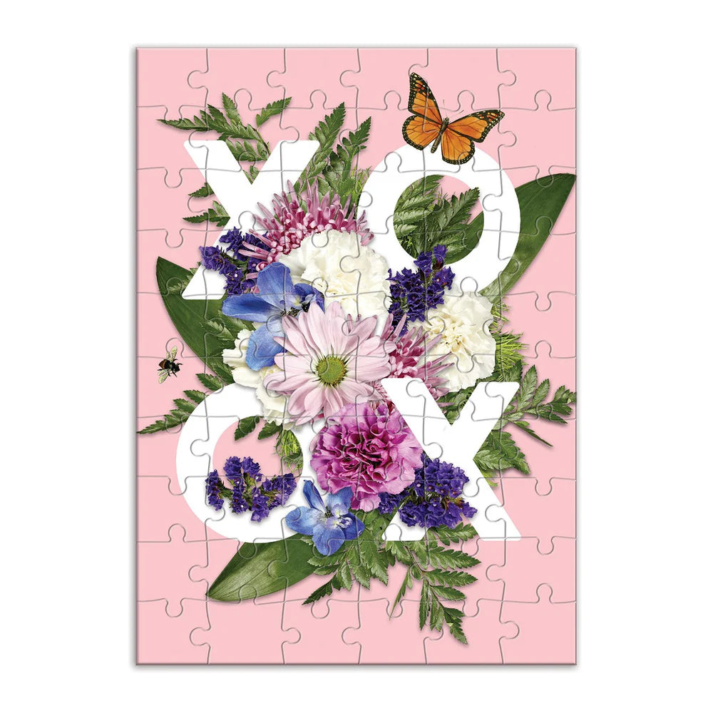 greeting card puzzle with lfowers and butterflies surrounding "XOXO".