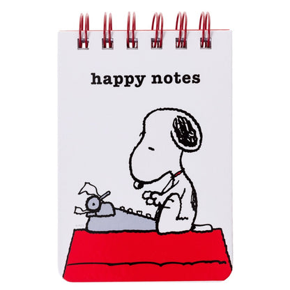 white notebook with snoopy typing on a typewriter with white title text