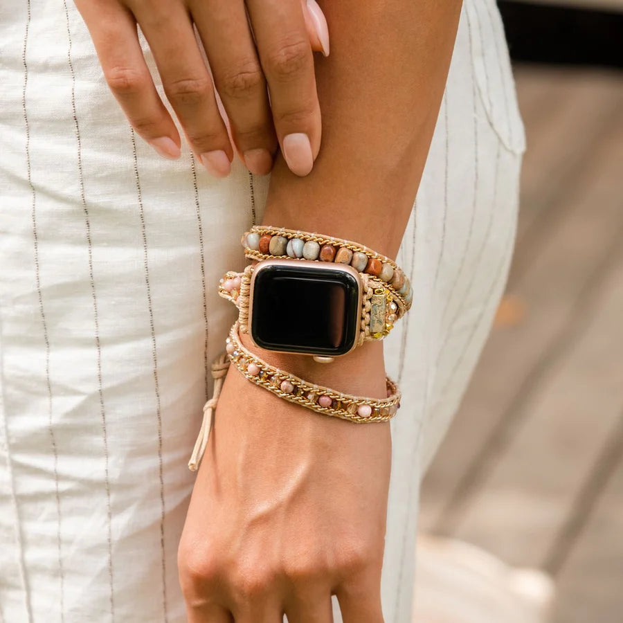 close-up of person's arm by their side wearing  Sweet Jasper strap on an apple watch.