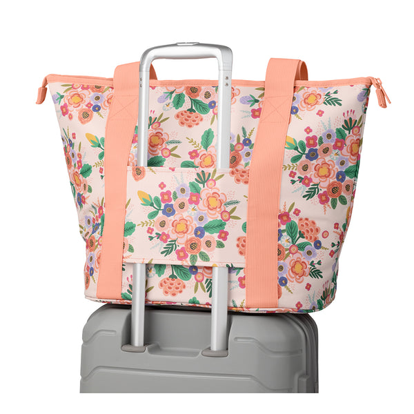 full bloom Zippi Tote Bag set on a rolling suitcase.
