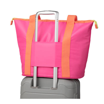 tutti frutti Zippi Tote Bag set on a rolling suitcase.