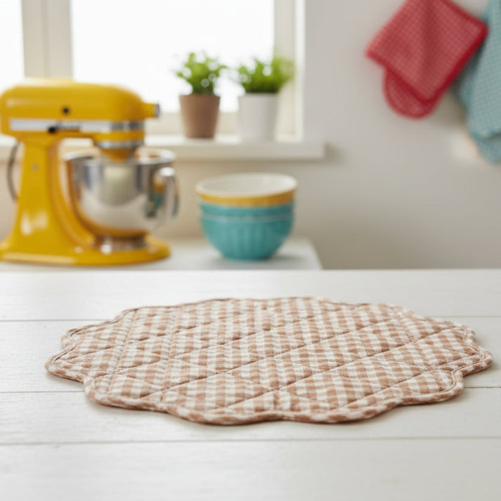 brown gingham placemat on a counter with a kitchen in the background