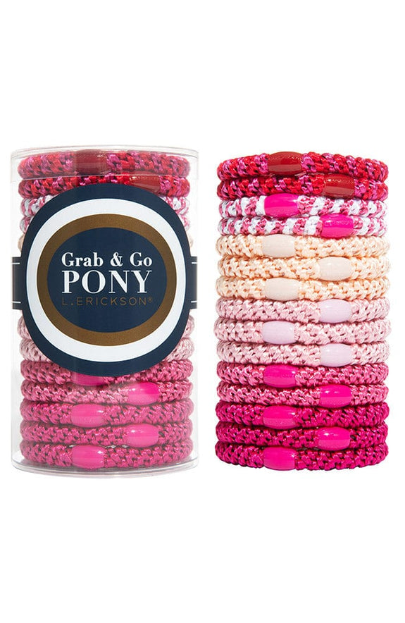 think pink tube of 15 ponytail holders set next to a stack of 15 ponytail holders each with coordinating oval bead on a white background.