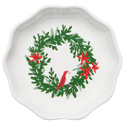 White dish with green wreath printed on it, wreath has red flowers in a small bird sitting on the bottom of it.