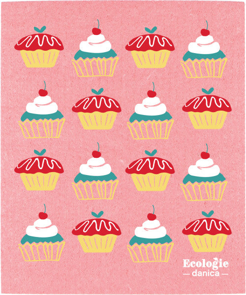 cake walk Swedish Sponge Dishcloth has a pink background with a variety of cupcake artwork printed on it.