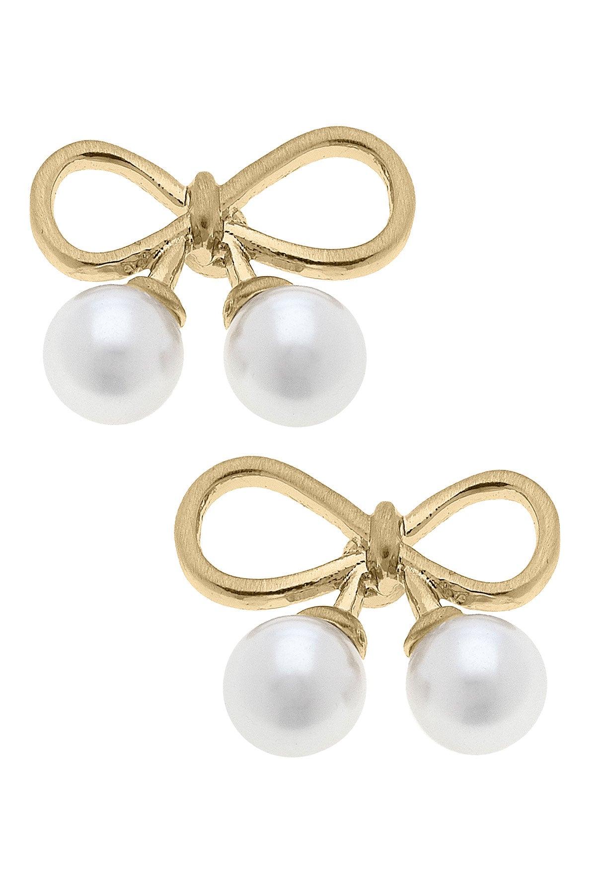 gold bow earrings with pearl accents.