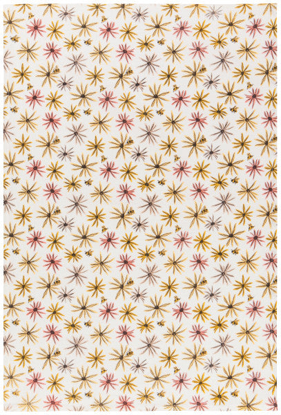white flour sack towel with all-over paattern of flowers and bees in yellows and pinks.