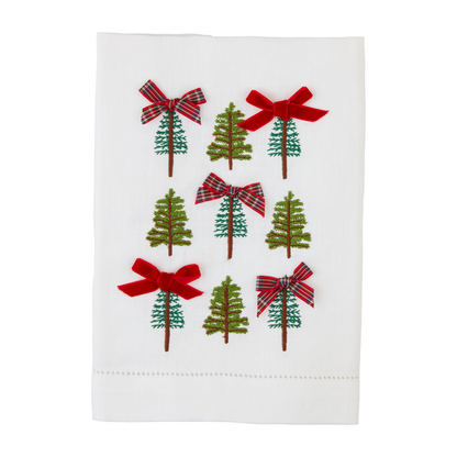 white towel with 9 embroidered trees on it and bows on several of the trees.