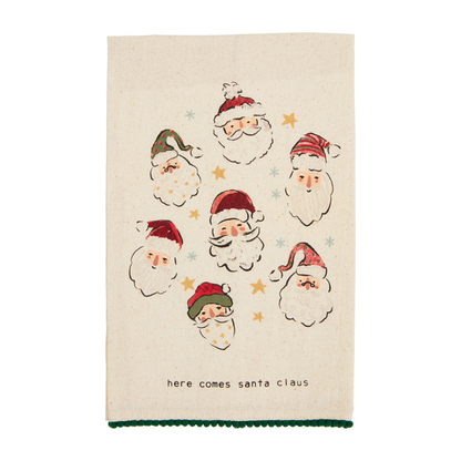 Towel printed with several Santa faces, and "here comes Santa" across the bottom.