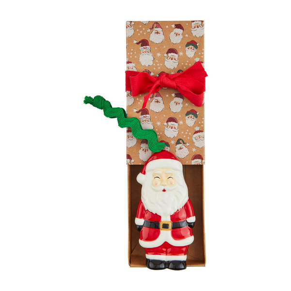 santa ornament laying in its box.