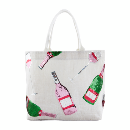 white tote with sequined champagne bottles stitched on it.