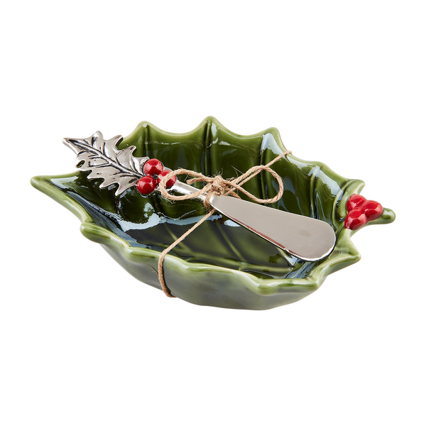 holly shaped bowl with holly spreader tied on top of it.