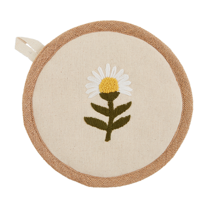 potholder with white daisy with yellow center and green stem in the center.