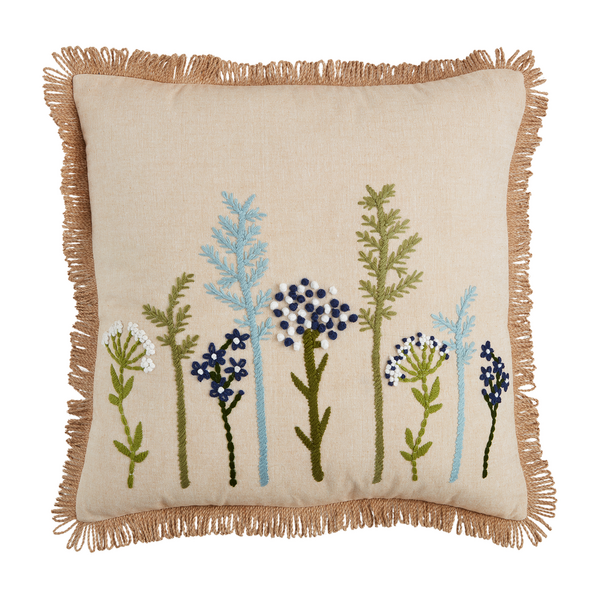 square pillow with embroidered greenery in olive green, light and dark blue, and white.