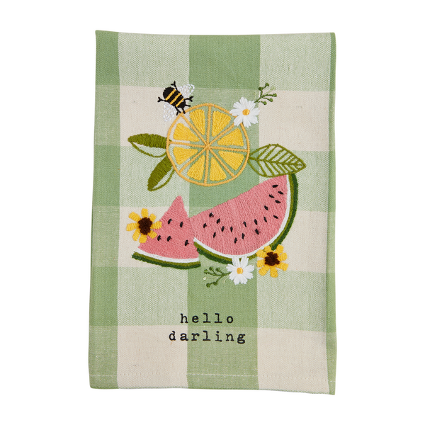 green check hand towel embroidered with lemon, watermelon, flowers and a bee and "hello darling" printed on the bottom.