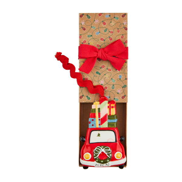 car with gifts ornament laying in its box.