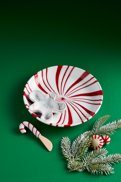 peppermint chip and dip set shown on a green background with a sprig of greenery and felt peppermints.