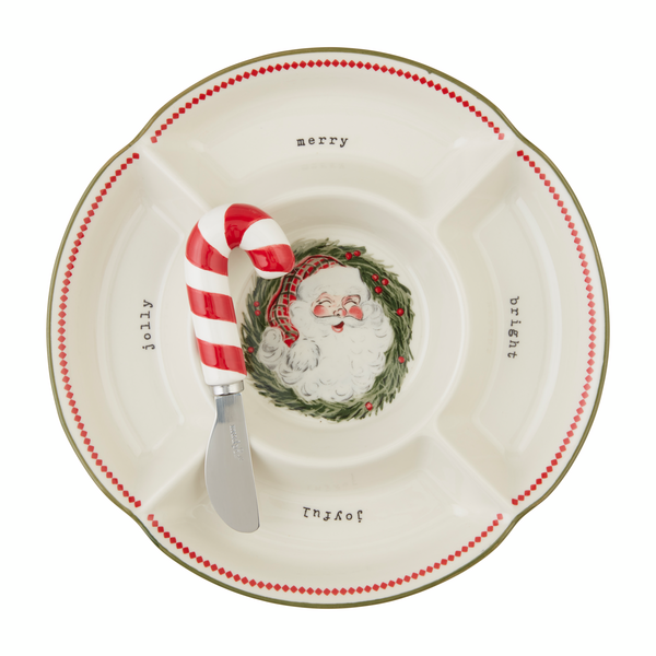 Divided Santa platter with a candy cane spreader laid on it.