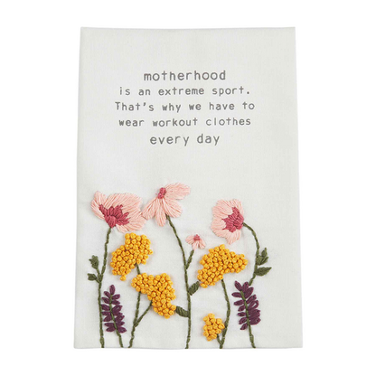 motherhood towel with embroidered flowers.