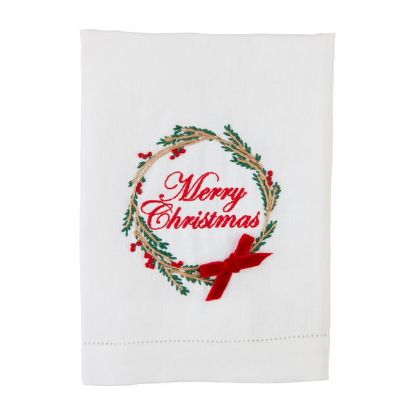 white towel with embroidered wreath on it and "merry christmas" in the center of the wreath.