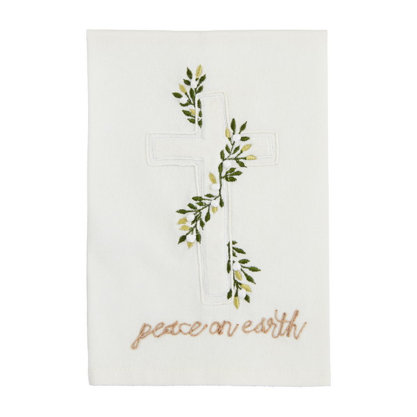 White towel with cross adorned with mistletoe and "peace on Earth" stitched along the bottom.