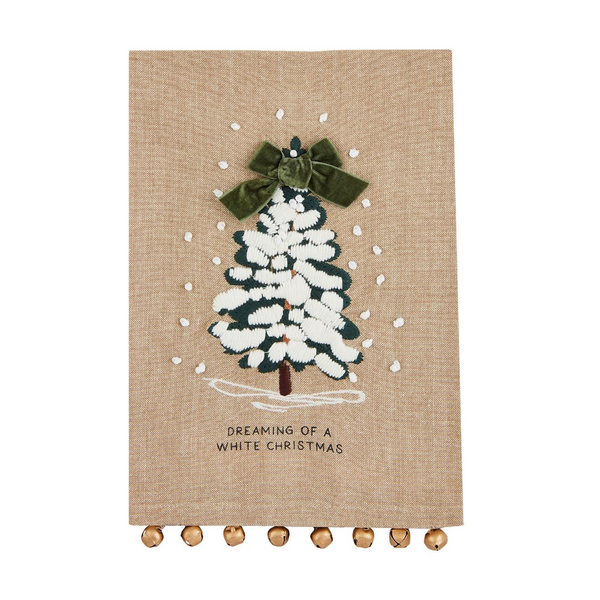 embroidered chambray towel with tree design and "dreaming of a white christmas" printed on it.