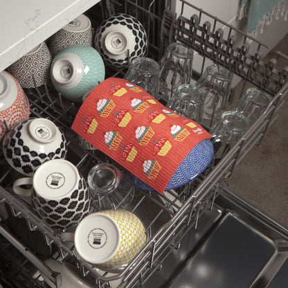 cake walk Swedish Sponge Dishcloth laying in a dishwasher.