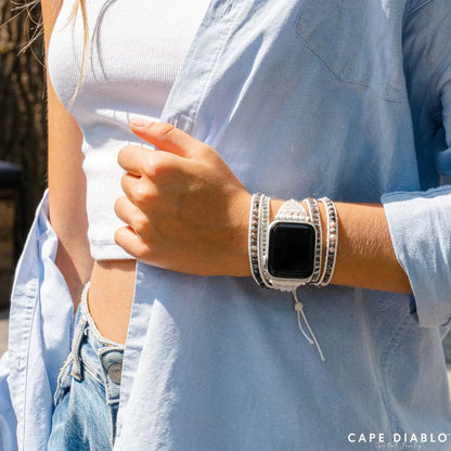 person wearing a blue shirt and Labradorite strap on an apple watch.