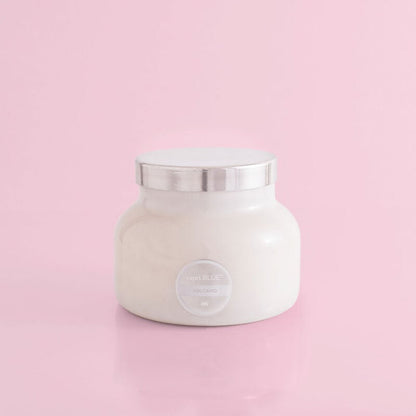 Volcano Signature White Jar Candle on alight pink background.
