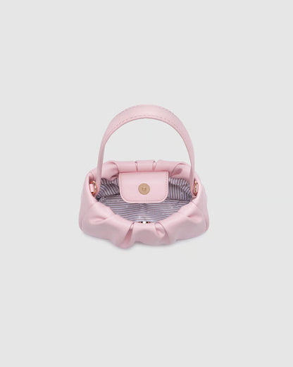 interi view of Pink handbag on a light gray background