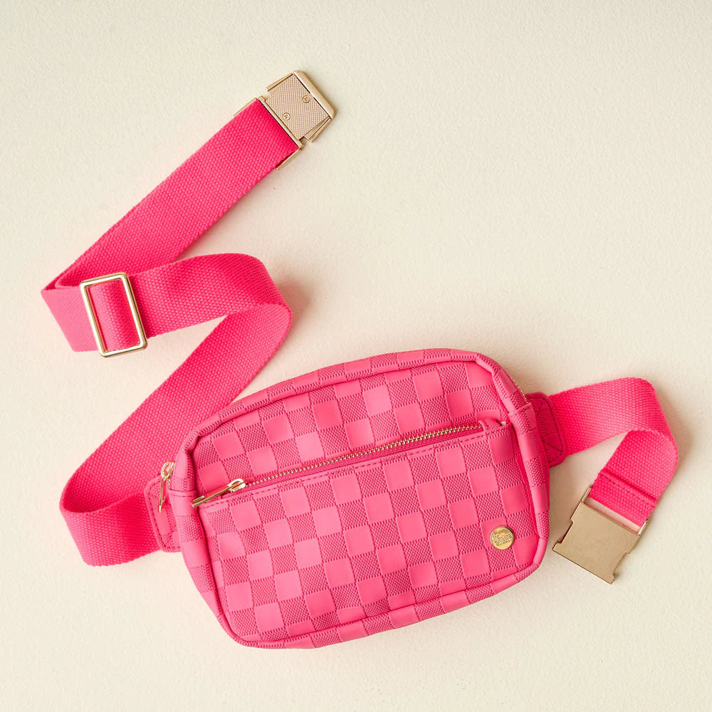 hot pink Urban Check Belt Bag arranged on a cream background.
