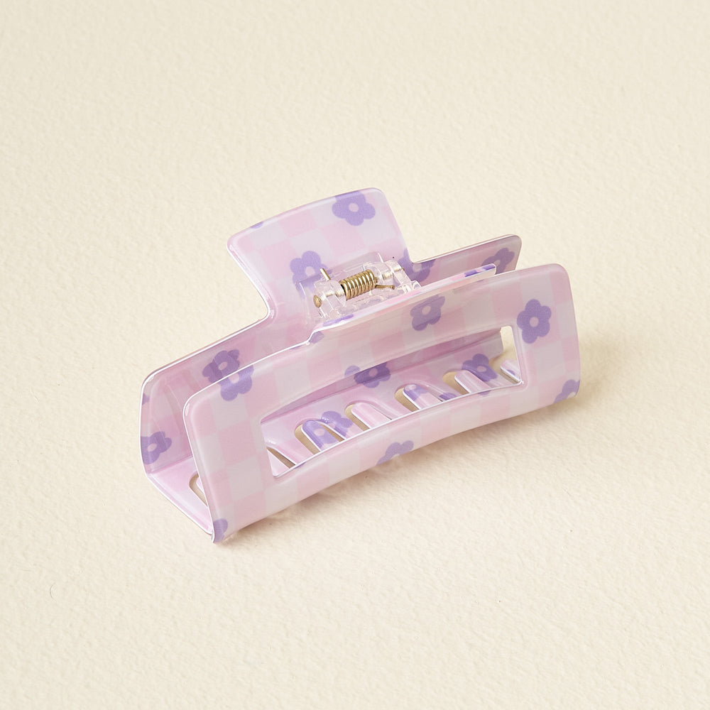 purple check claw clip on an off-white background.