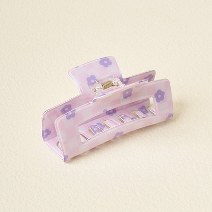 purple check claw clip on an off-white background.