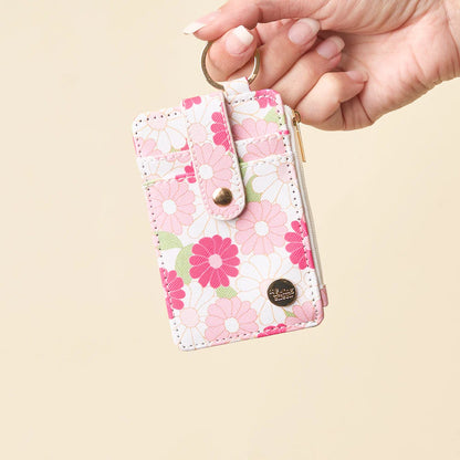 hand holding hot pink Daisy Craze Keychain Card Wallet by the keyring.