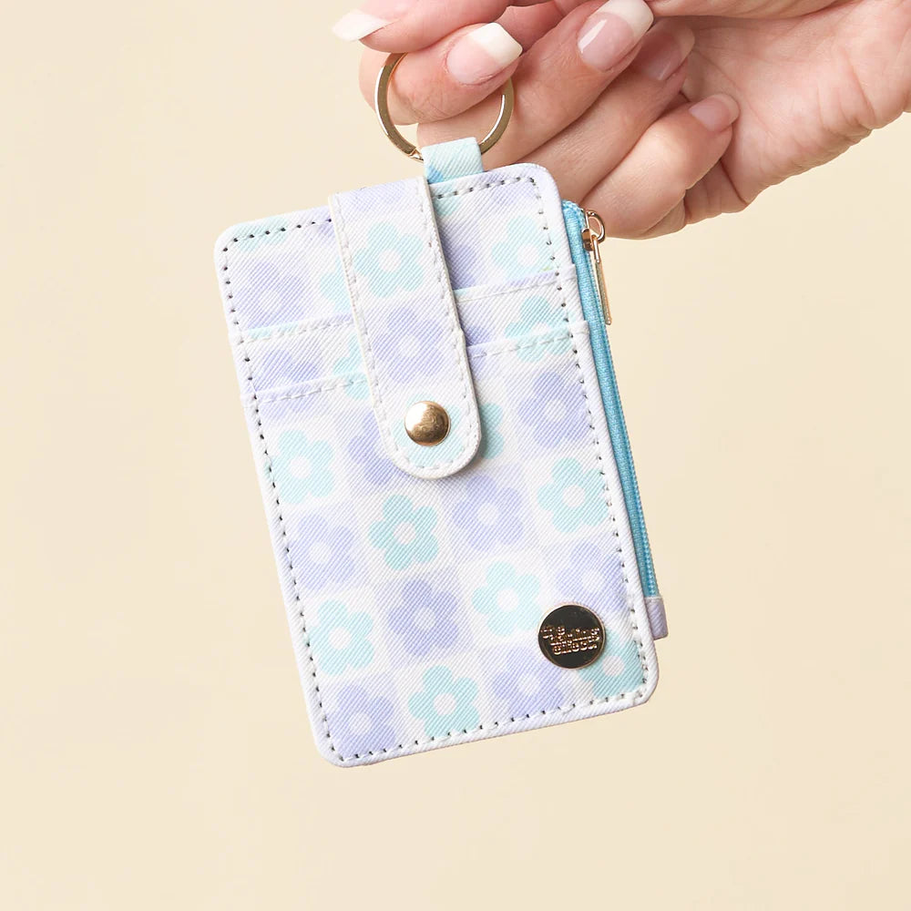 hand holding blue Flower Check Keychain Card Wallet by the keyring.