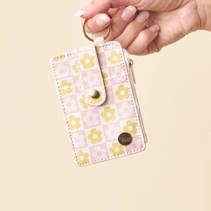 hand holding peach Flower Check Keychain Card Wallet by the keyring.