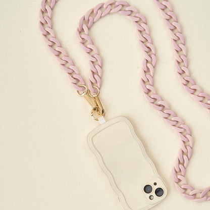 lilac phone chain with phone attached arranged on an off-white background.