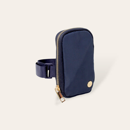 navy tumbler fanny pack on a white background.