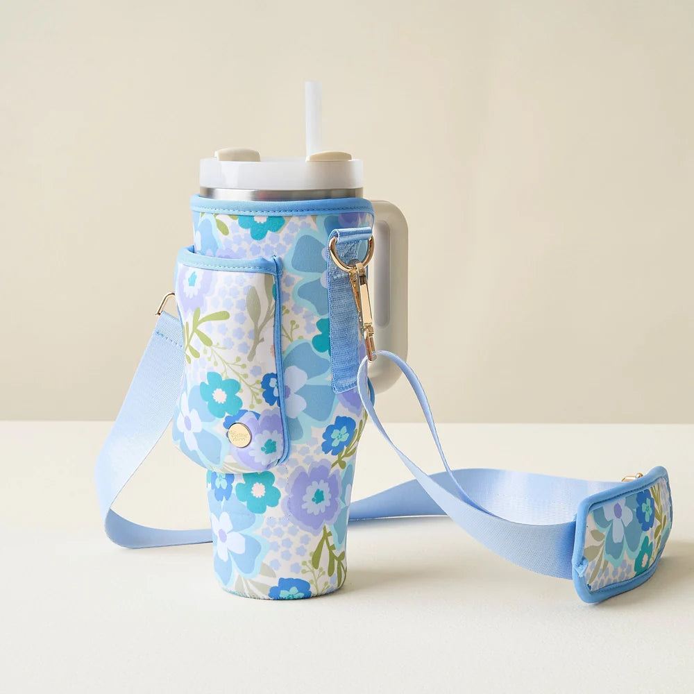 beyond blooms blue and green tumbler sling set on an off-white table.