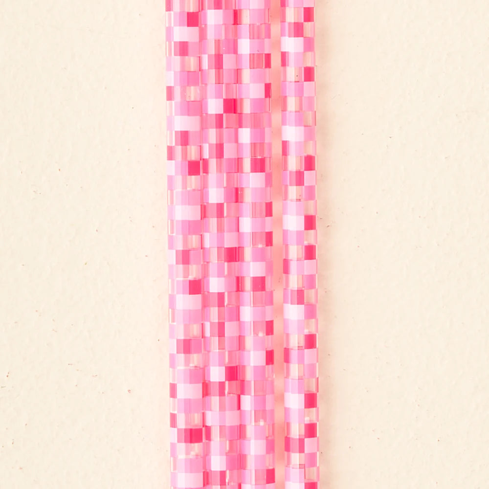 close-up of 4 pink check straws.