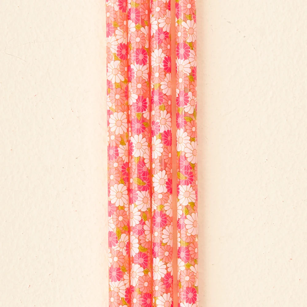 close-up of 4 pink daisy craze straws.