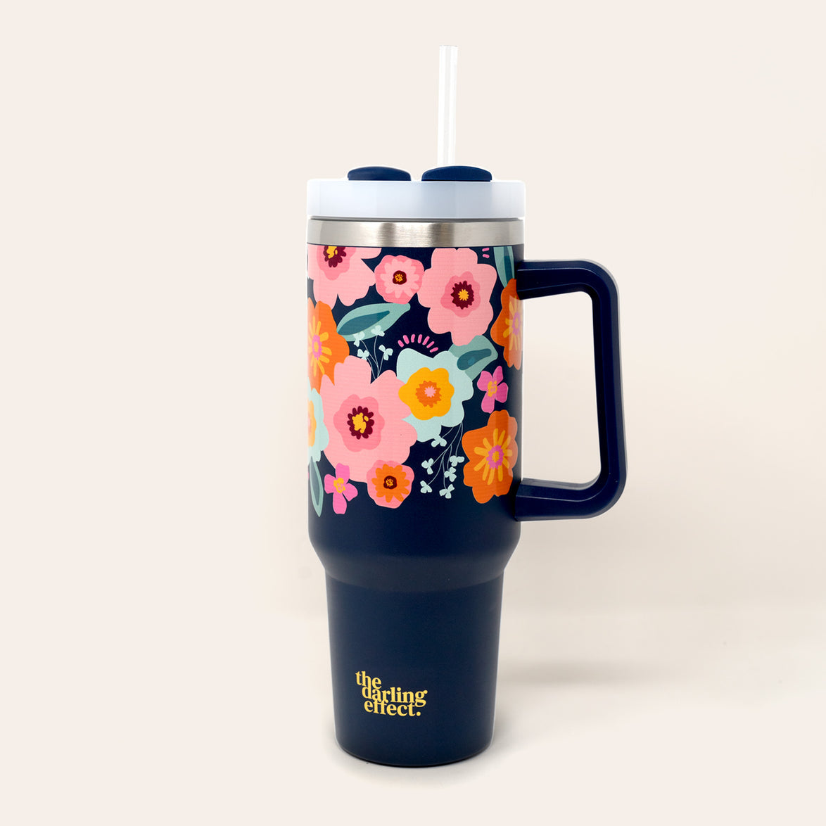 bright and bloomy take me everywhere tumbler is navy with hot pink and orange flowers all over