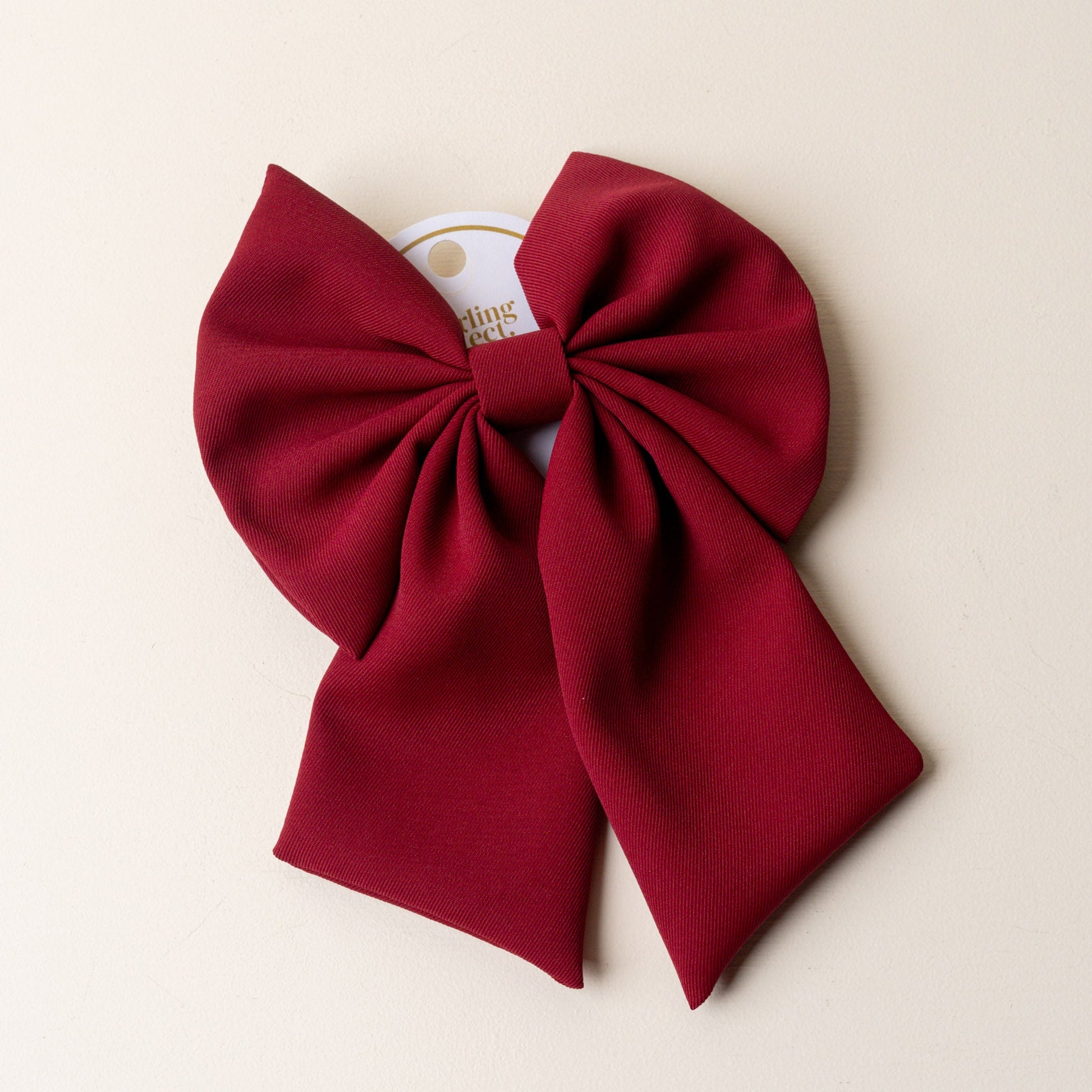 burgundy hair bow.