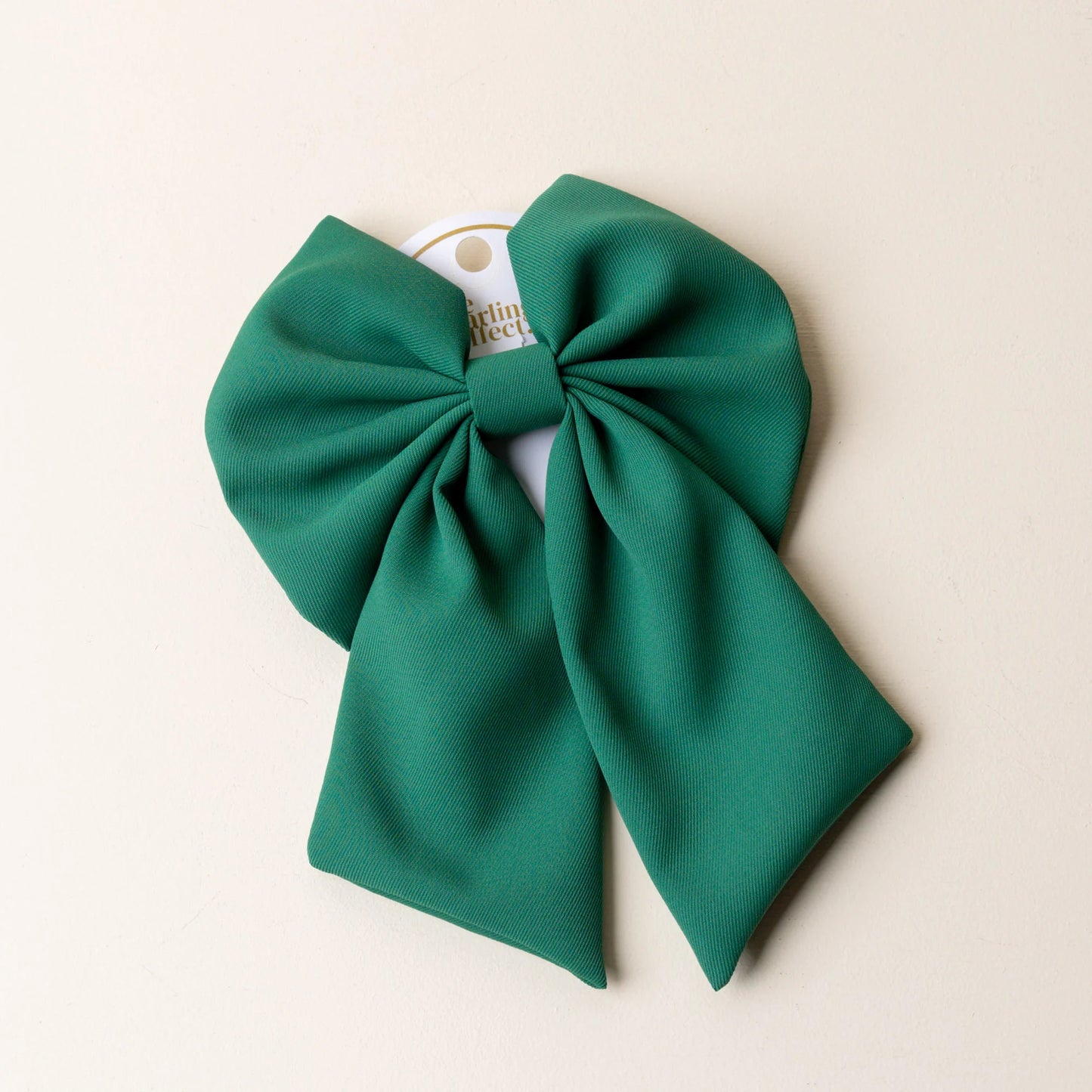 green hair bow.