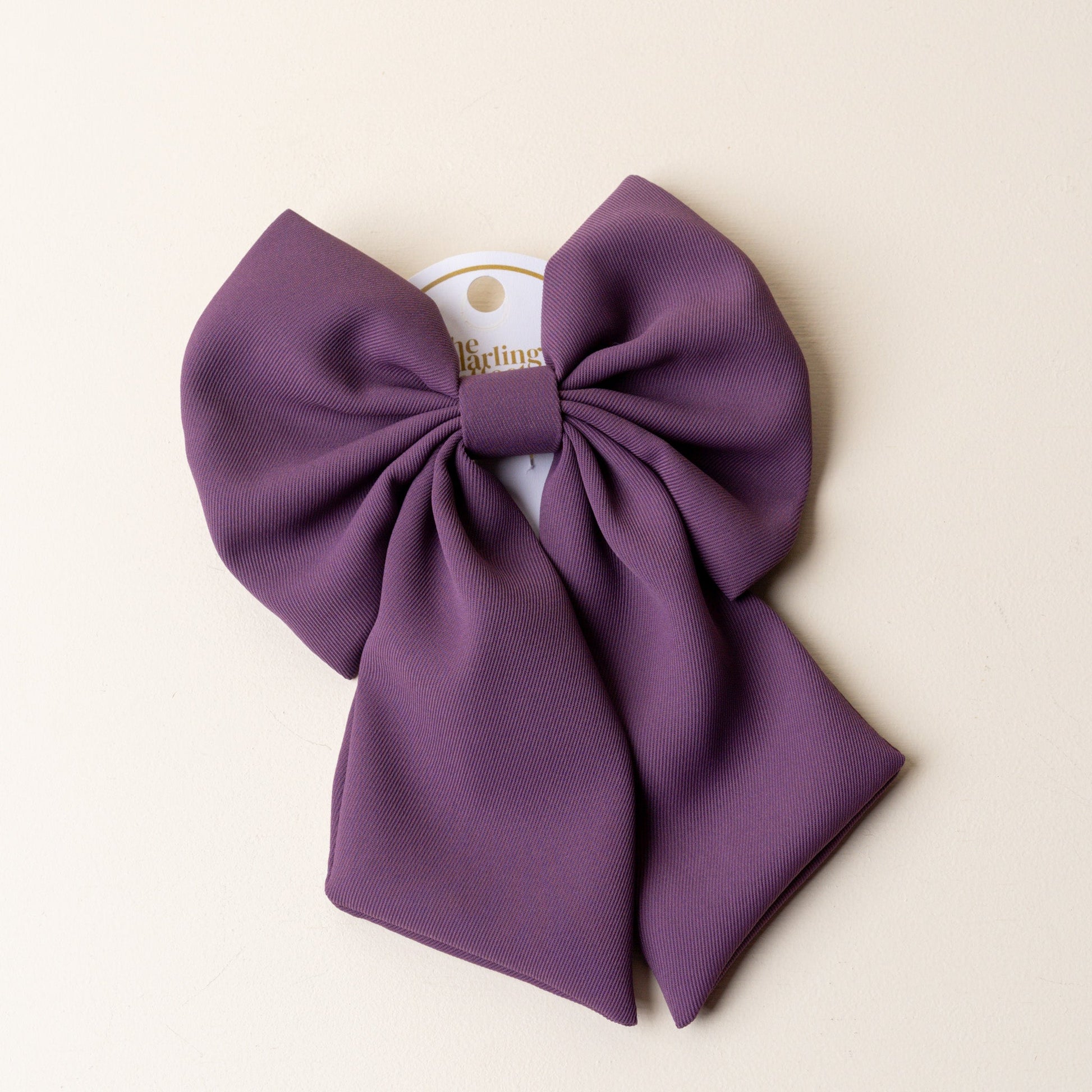 purple hair bow.