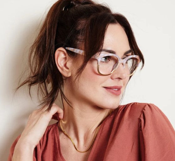 angled view of a woman modeling the Tan Marble & Gold Georgia Blue Light Reading Glasses